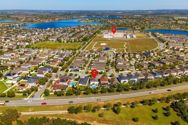 bird's eye view with a water view and a residential view