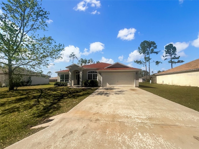 view of front of house with a garage, a front yard, driveway, and stucco siding
