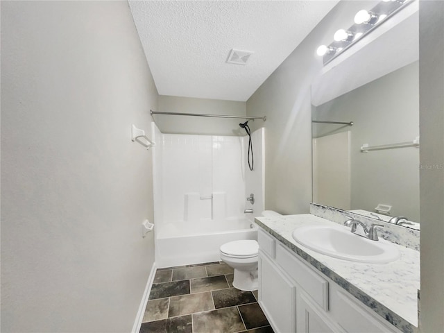 bathroom featuring vanity, washtub / shower combination, visible vents, a textured ceiling, and toilet