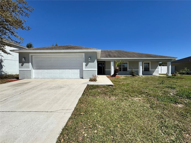 ranch-style home featuring a front yard, a garage, driveway, and stucco siding