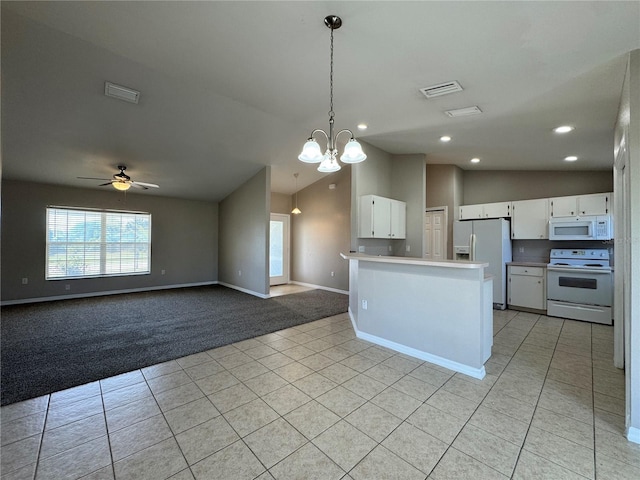 kitchen with light colored carpet, light tile patterned floors, a peninsula, white cabinets, and white appliances