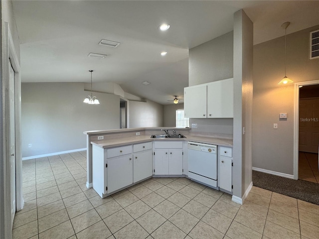 kitchen featuring ceiling fan with notable chandelier, light tile patterned flooring, light countertops, lofted ceiling, and dishwasher