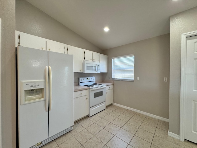 kitchen featuring white appliances, lofted ceiling, light tile patterned flooring, light countertops, and white cabinets