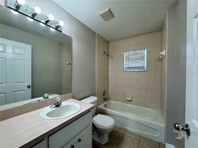 full bathroom with visible vents, tub / shower combination, toilet, tile patterned floors, and vanity