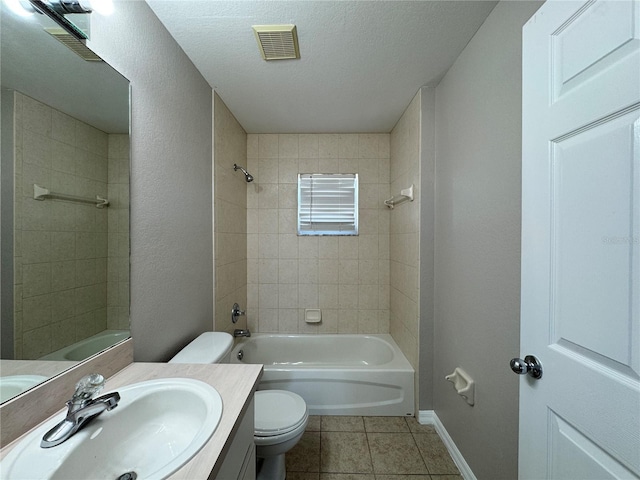 full bathroom featuring visible vents, tub / shower combination, toilet, tile patterned floors, and vanity