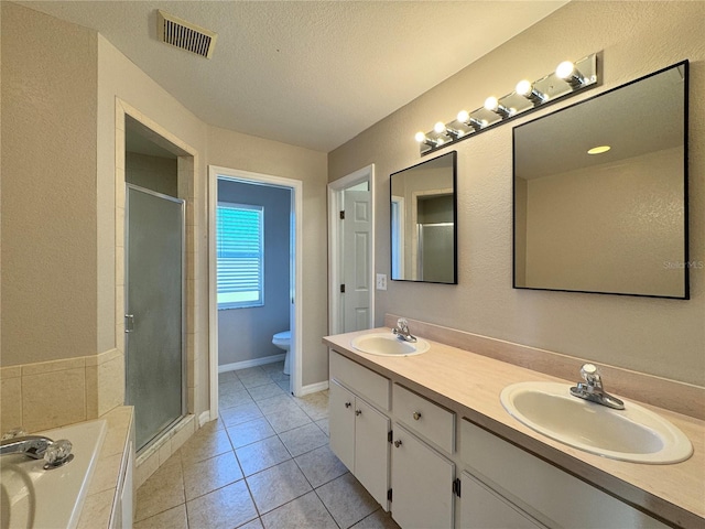 full bath featuring visible vents, a shower stall, and a sink