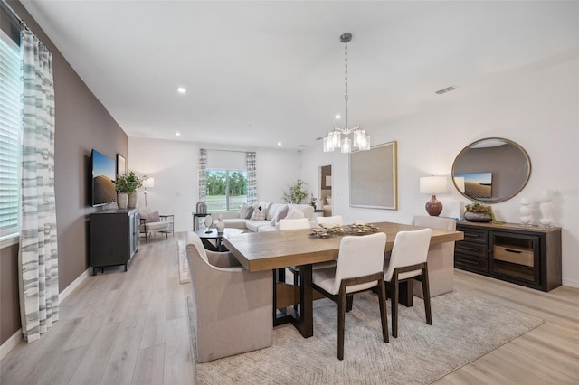 dining room with visible vents, light wood finished floors, baseboards, an inviting chandelier, and recessed lighting