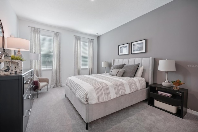 bedroom featuring light colored carpet