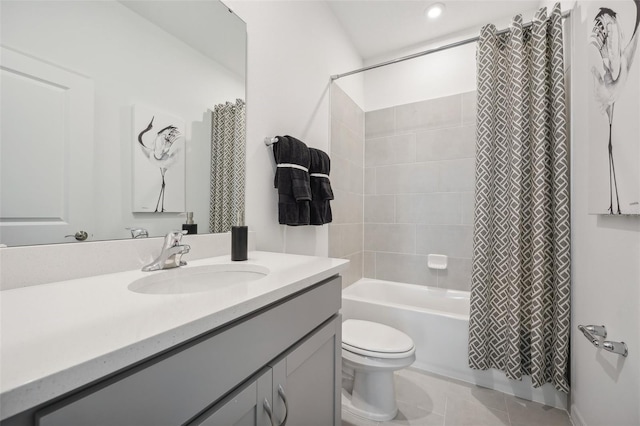 bathroom featuring tile patterned floors, toilet, shower / bath combo, and vanity