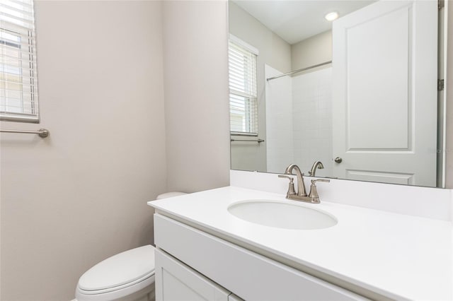 full bath with toilet and vanity