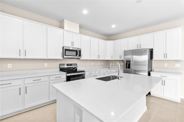 kitchen featuring a sink, light countertops, white cabinets, and stainless steel appliances