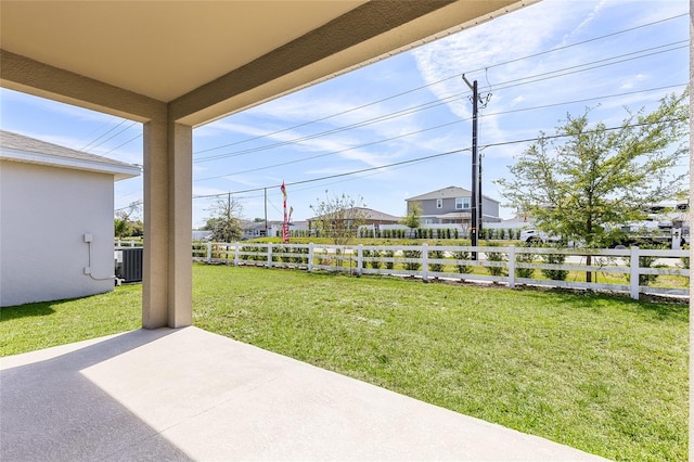 view of yard with central air condition unit, a patio, and fence