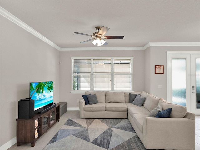 living room featuring french doors, baseboards, a ceiling fan, and ornamental molding