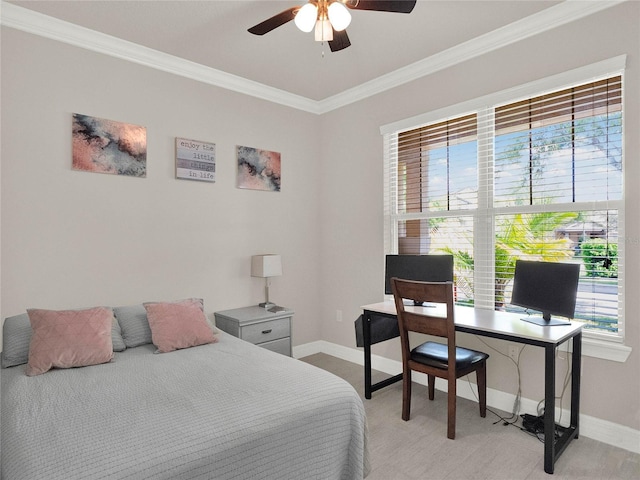 bedroom with baseboards, ceiling fan, and crown molding