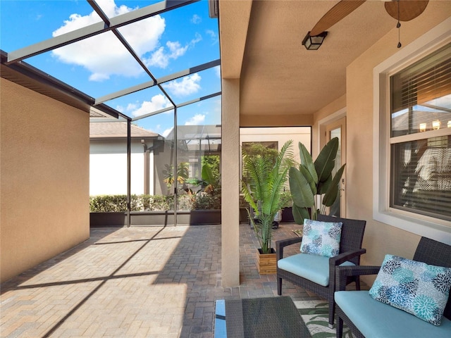 view of patio / terrace featuring a lanai