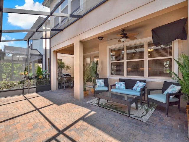 view of patio / terrace featuring a lanai, a grill, an outdoor hangout area, and a ceiling fan