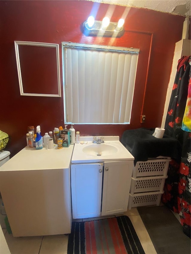 bathroom with vanity and tile patterned floors