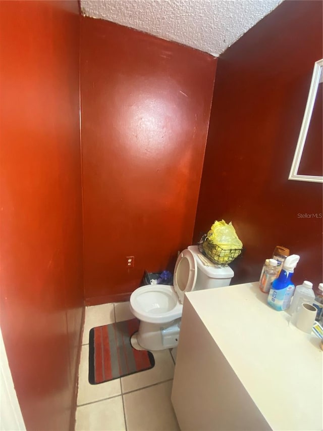 bathroom featuring tile patterned floors and toilet