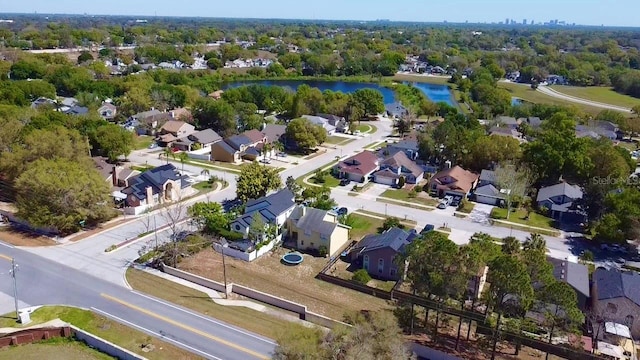 birds eye view of property featuring a residential view and a water view