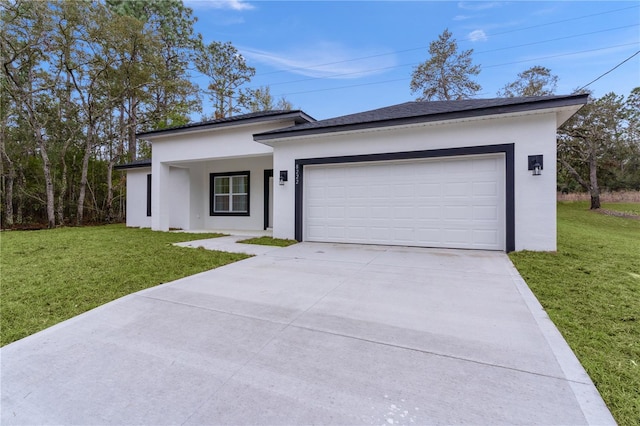 view of front of house featuring stucco siding, concrete driveway, a front lawn, and a garage