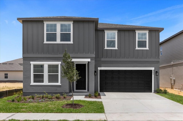 view of front of property with concrete driveway, an attached garage, and board and batten siding