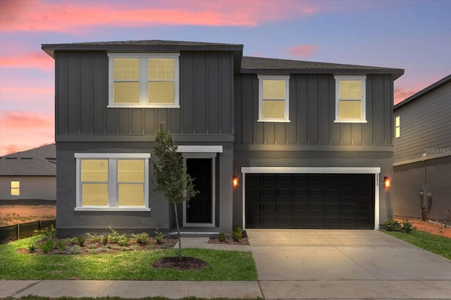 view of front of home featuring concrete driveway, a garage, fence, and board and batten siding