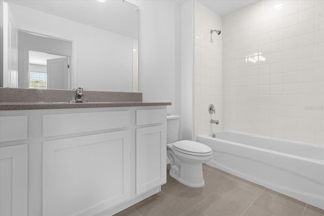 full bathroom featuring tile patterned floors, toilet, vanity, and bathtub / shower combination