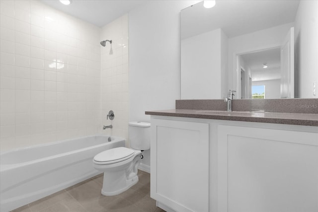 bathroom with vanity, toilet, shower / bathtub combination, and tile patterned flooring