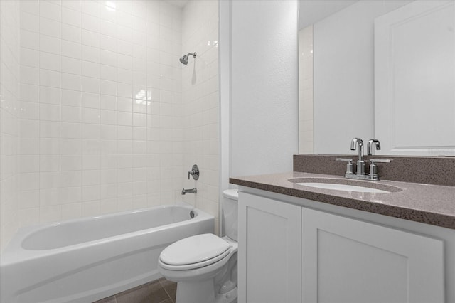 full bath featuring tile patterned flooring, shower / washtub combination, toilet, and vanity