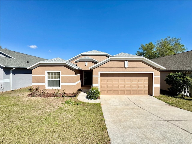 ranch-style house with stucco siding, a front lawn, roof with shingles, concrete driveway, and an attached garage