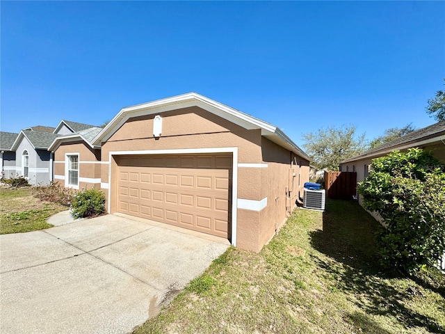 view of front of house featuring central AC unit, fence, driveway, and stucco siding