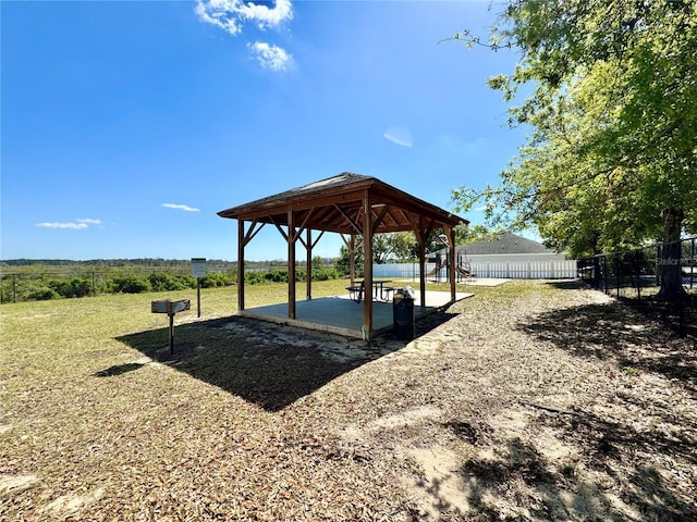 exterior space with a gazebo and fence