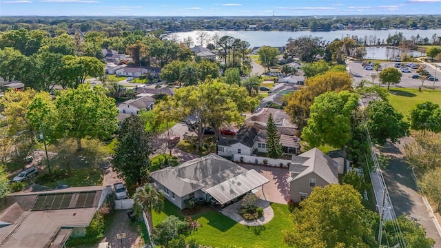 drone / aerial view featuring a water view and a residential view