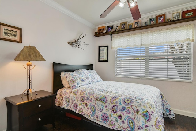 bedroom with ceiling fan, crown molding, baseboards, and wood finished floors