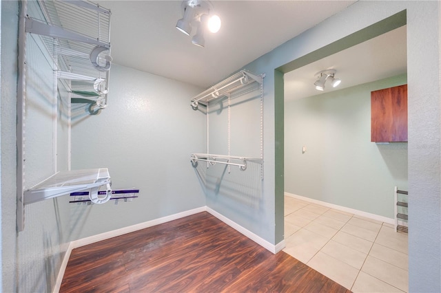 spacious closet featuring wood finished floors