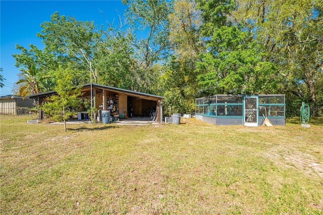 view of yard featuring an outbuilding and a vegetable garden