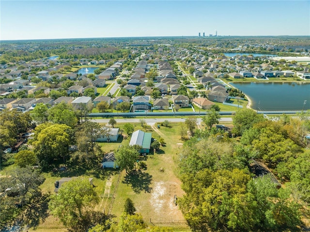 birds eye view of property featuring a water view and a residential view