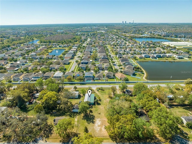 bird's eye view with a residential view and a water view