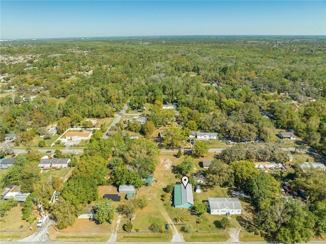 bird's eye view featuring a wooded view