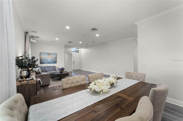 dining space with visible vents, crown molding, baseboards, recessed lighting, and wood finished floors