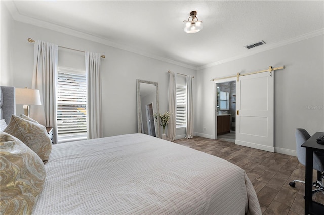 bedroom with a barn door, crown molding, multiple windows, and wood finished floors