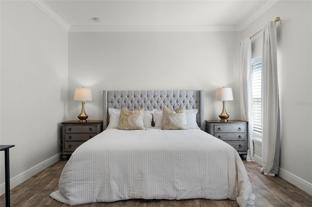 bedroom featuring crown molding, wood finished floors, and baseboards