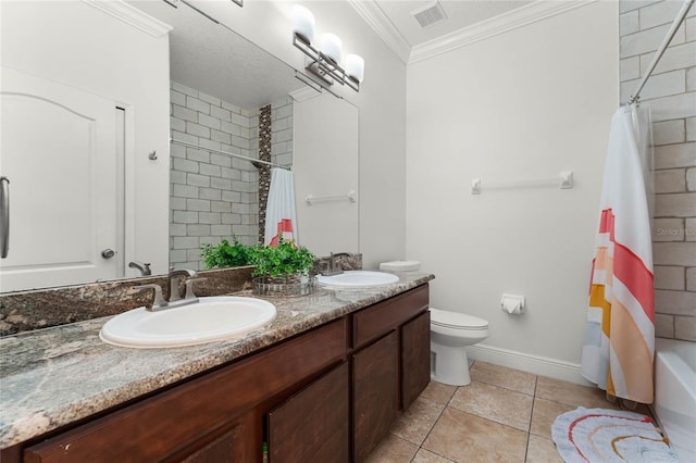 bathroom featuring visible vents, toilet, crown molding, and a sink