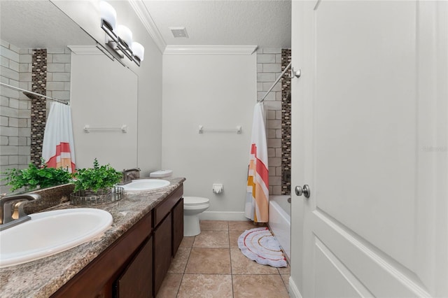 bathroom with visible vents, a textured ceiling, crown molding, and a sink