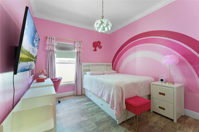 bedroom with baseboards, an inviting chandelier, wood finished floors, and crown molding