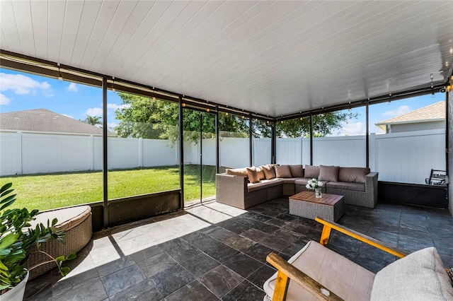 unfurnished sunroom with plenty of natural light