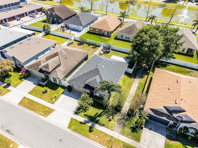 bird's eye view with a residential view and a water view