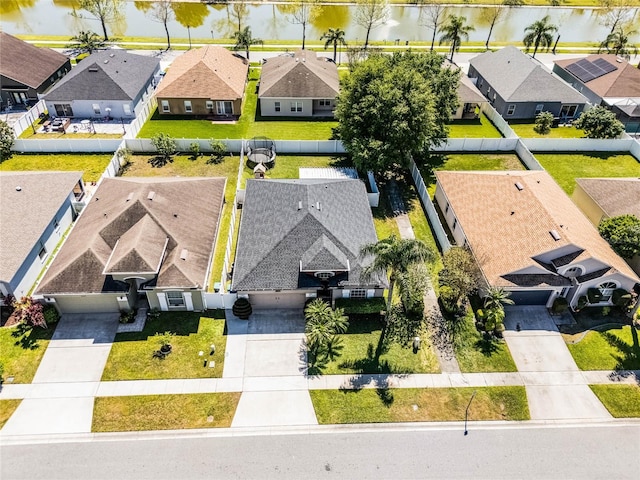 birds eye view of property with a residential view