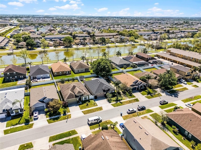 bird's eye view with a residential view and a water view