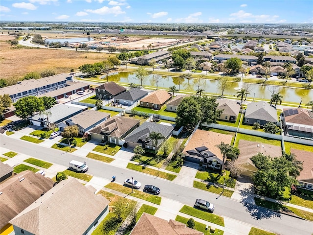 birds eye view of property with a residential view and a water view